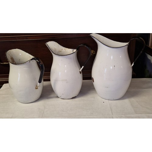 127 - 3 X VINTAGE SWEDISH GRADUATED ENAMEL JUGS - LARGEST JUG 32CMS H