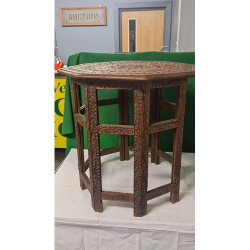 37 - BEAUTIFUL FOLDING CARVED INDIAN OCCASSIONAL TABLE - 58CMS H X OVERALL DIAM TO TOP IS 55CMS