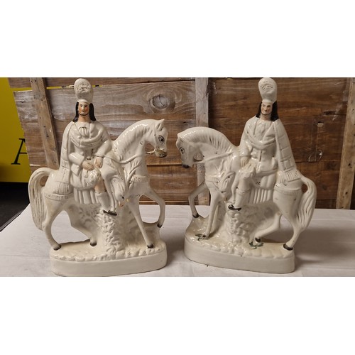 215C - PAIR OF STAFFORDSHIRE FLATBACKS OF MAN ON HORSEBACK - SOME DAMAGE & SOME REPAIR - 38CMS H