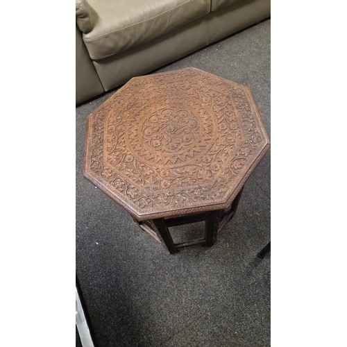 37 - BEAUTIFUL FOLDING CARVED INDIAN OCCASSIONAL TABLE - 58CMS H X OVERALL DIAM TO TOP IS 55CMS