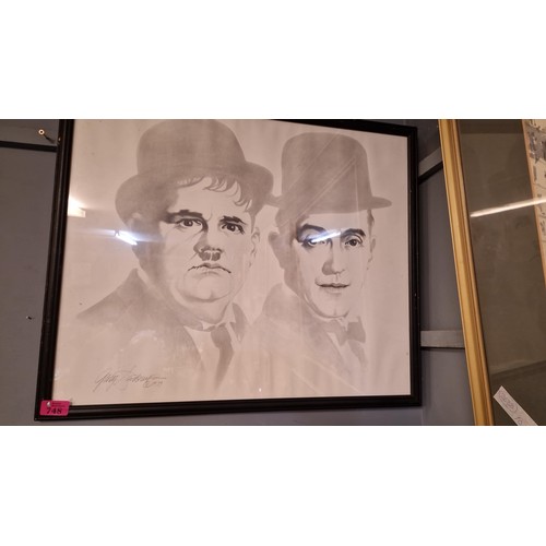 748 - FRAMED & GLAZED 1979 LAUREL & HARDY PICTURE - SIGNED BY ARTIST - 55CMS X 65CMS - COLLECTION ONLY OR ... 