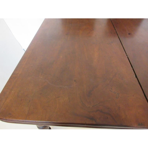 109 - An early 19th century mahogany dining table, the rectangular top having two spare leaves and raised ... 