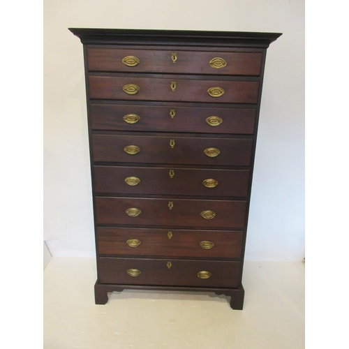 125 - A fine Georgian mahogany chest of eight graduated drawers having brass handles and key plates and ra... 