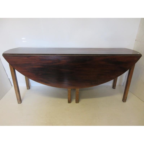 134 - Georgian mahogany Irish hunt table raised on eight square legs. Length 68