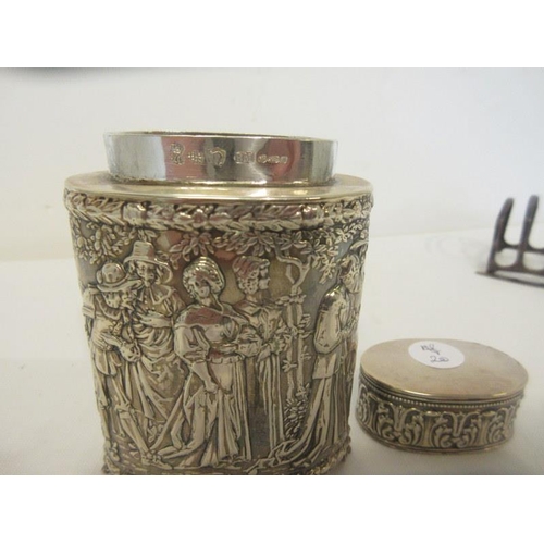 149 - Sterling silver (925) canister and lid embossed with numerous figures.