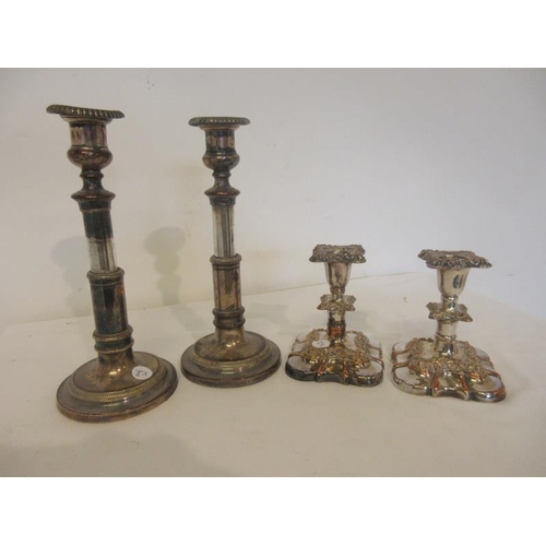 168 - Pair of 19th century telescopic plated candlesticks together with a later low pair. (4)