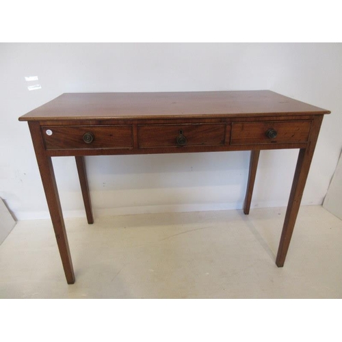 181 - Georgian mahogany side table fitted with three drawers and raised on square tapered legs. W. 42