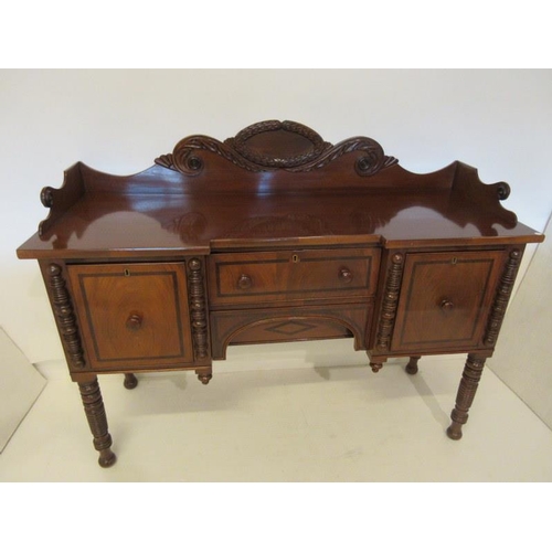 191 - Antique mahogany (Cork) sideboard having carved tray back, fitted with drawers and presses and raise... 