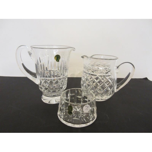 204 - Two Waterford glass jugs and a bowl. (3)