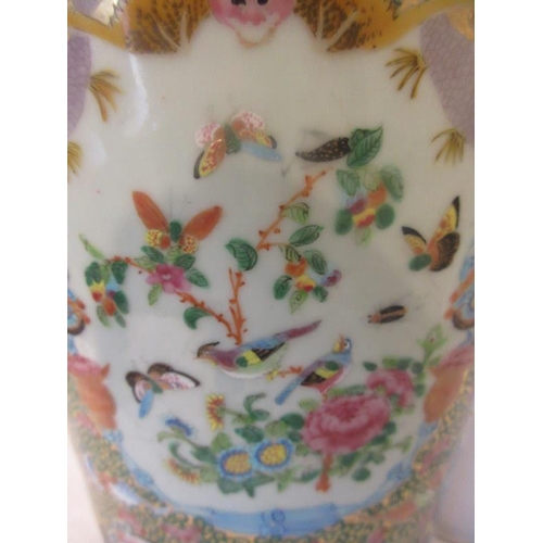 217 - A 19th century Chinese cantonese vase decorated with large panels of figures and lesser panels of fl... 