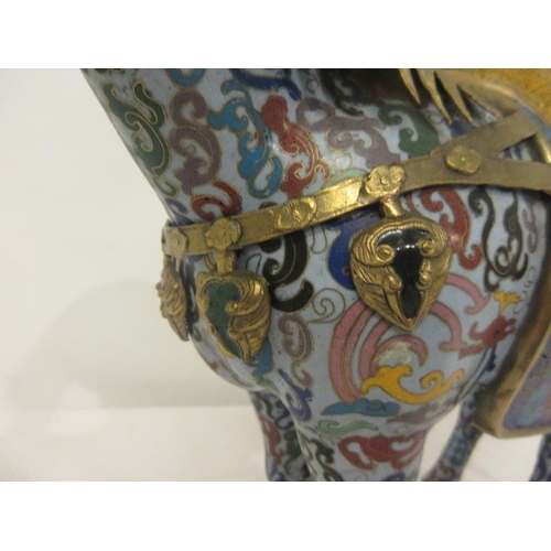 220 - A Chinese Cloisonne enamel figure of a standing war horse. In the style of a pottery horse of the Ta... 