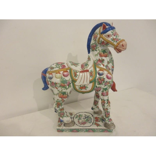 226 - A Chinese porcelain horse standing on plinth base. 
H. 14