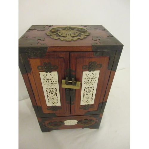 227 - A Chinese jewellery cabinet with brass and ivory decoration. H. 12