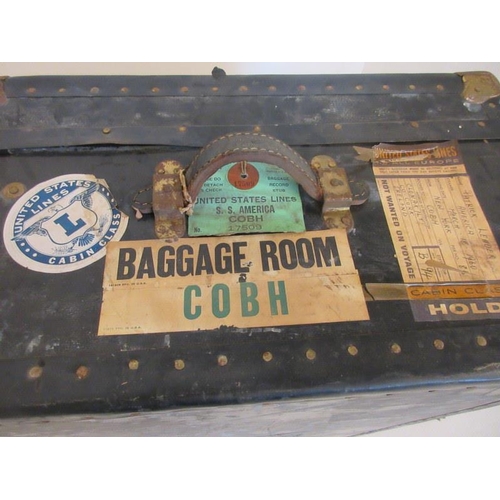 24 - Three old suit cases and a travelling trunk - interesting labels.