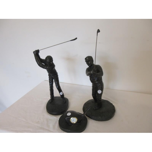 241 - Two Jeanne Rynhart figures of golfers and a clock in the form of a golf club. (3)