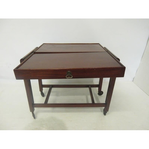 61 - A mahogany two tier trolley/folding table.