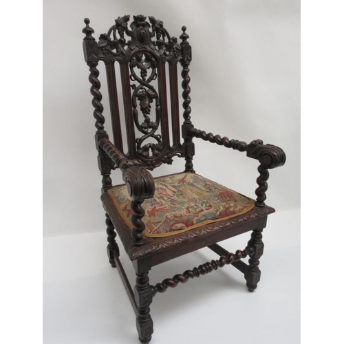 64 - A good antique carved oak throne chair.