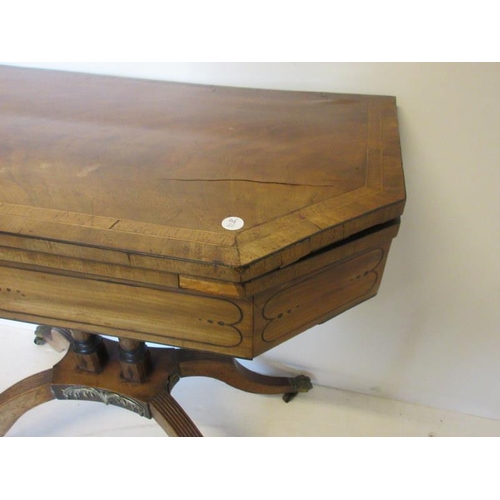 97 - Regency mahogany and brass mounted card table, the shaped folding top raised on twin pillar support,... 