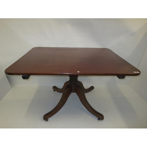 139 - Antique mahogany dining table raised on centre turned column and four splay feet. 49