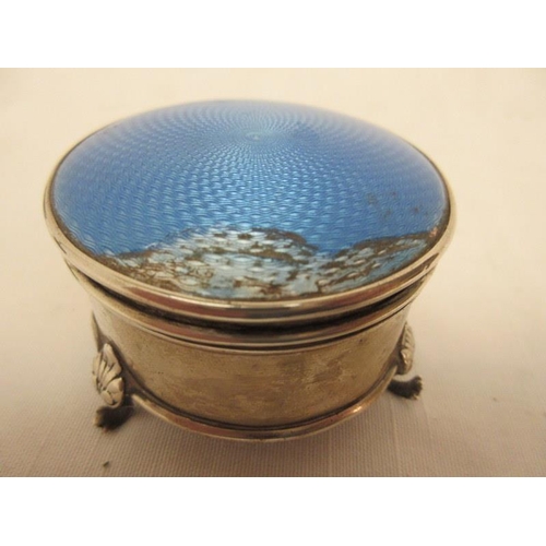 140 - A silver and enamel jewellery box Birmingham 1926, a blue glass circular box and lid with enamel dec... 