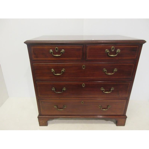 194 - Georgian mahogany chest of two short and three long graduated drawers raised on bracket feet. W. 37