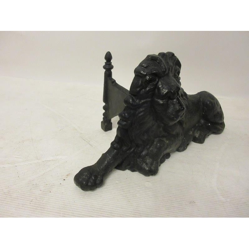 207 - A cast iron foot scraper in the form of a lion.