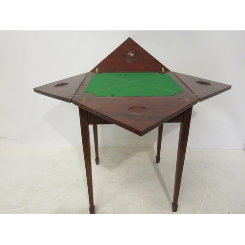 219 - An Edwardian inlaid mahogany envelope card table fitted with a drawer and raised on tapered legs. 22... 