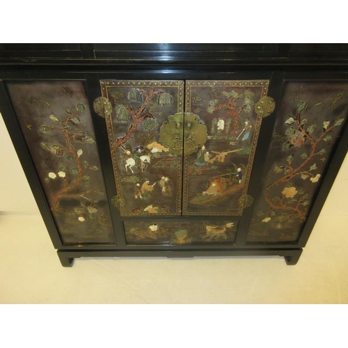 223 - A fine Chinese drawing room cabinet, the base section inlaid with figures in landscapes. H. 79