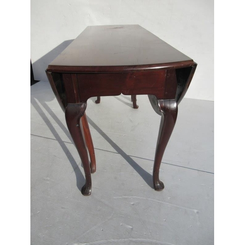 227 - A fine Irish Georgian mahogany drop leaf table raised on six legs with faceted pad feet. Width fully... 