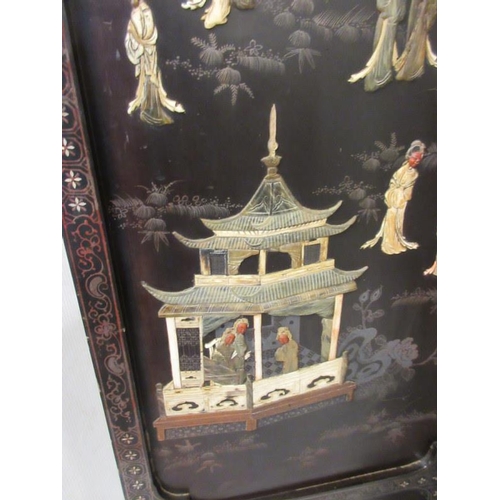 229 - A Chinese four panel back lacquer screen inlaid with mother of pearl and soapstone depicting court a... 