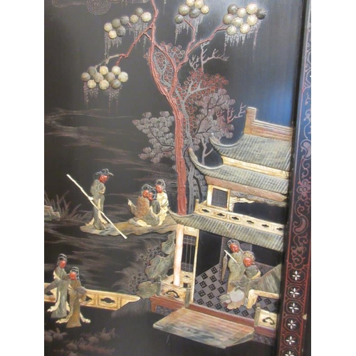 229 - A Chinese four panel back lacquer screen inlaid with mother of pearl and soapstone depicting court a... 