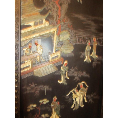 229 - A Chinese four panel back lacquer screen inlaid with mother of pearl and soapstone depicting court a... 