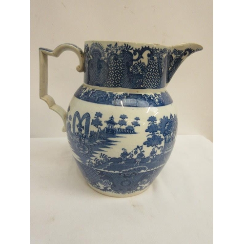 66 - An old blue and white tureen and cover and a large jug. (2)