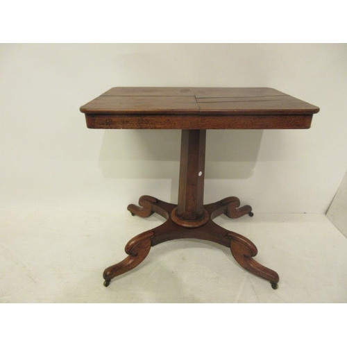 72 - A Victorian mahogany reading bedside table raised on centre column and four splay feet. (adjustable)... 