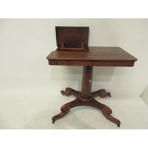 72 - A Victorian mahogany reading bedside table raised on centre column and four splay feet. (adjustable)... 