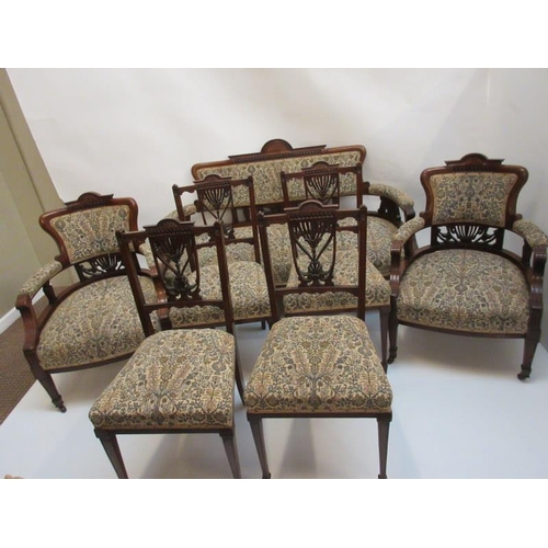 89 - An Edwardian mahogany drawing room suite comprising of a settee with matching armchairs and four sin... 