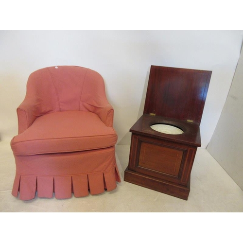 91 - An Edwardian mahogany commode and an easy chair. (2)