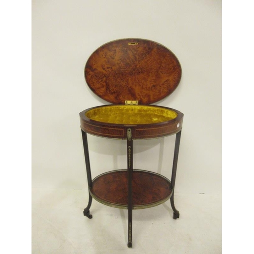 95 - An Edwardian inlaid birds eye maple curio table raised on four brass mounted legs. Width 22