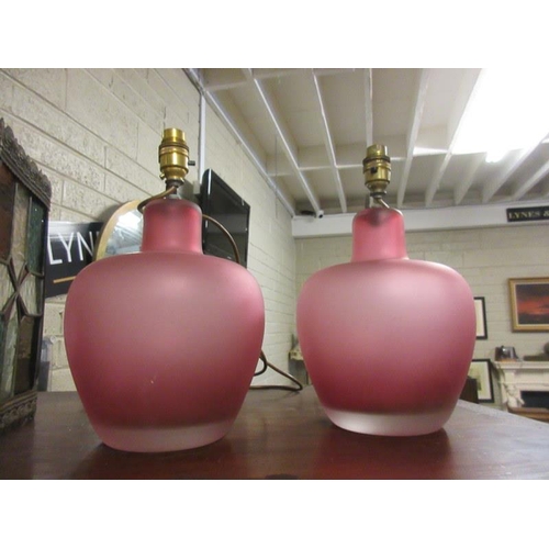 266 - Pair of red glass side lamps.