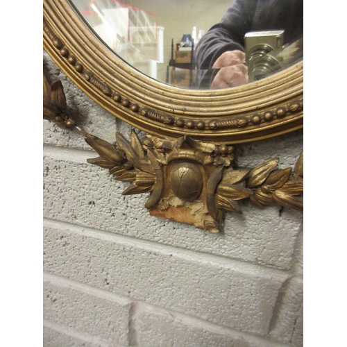38 - A decorative 19th century gilt framed oval hall mirror.
L. 100cm, W. 55cm approx. Condition - restor... 