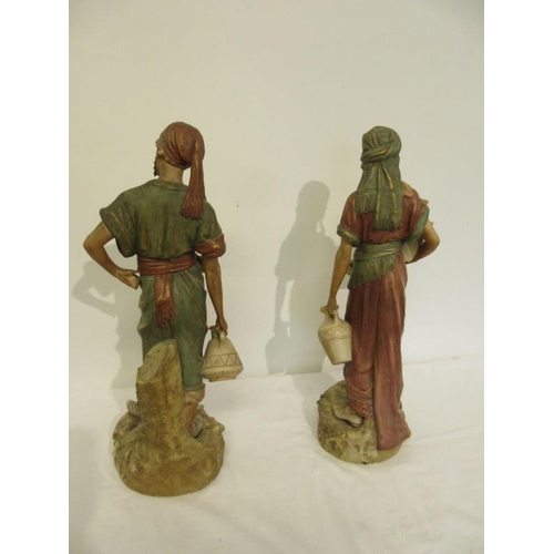 41 - A pair of 19th century Royal Dux figures of water carriers. H. 50cm approx. Overall condition is goo... 