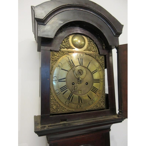 45 - An early 19th century long cased clock, the mahogany case with arched brass dial with weights and pe... 