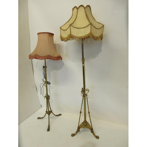 65 - Two antique brass standard floor lamps and shades. (2)