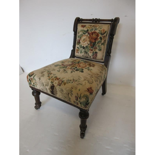 66 - Victorian nursing chair raised on turned legs.