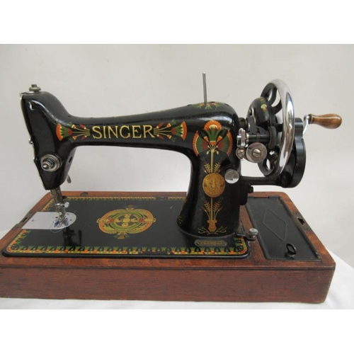 10 - Old Singer sewing machine complete with cover and key.