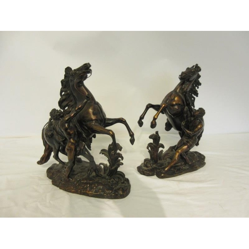 108 - A good pair of antique bronze Marley horses and horsemen, signed, excellent colour. H. 38cm approx.