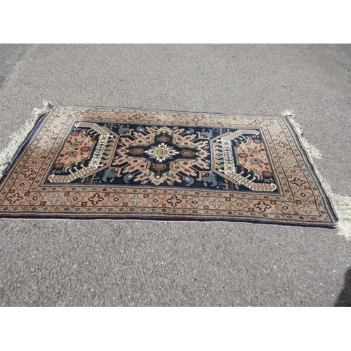 113 - Persian style rug. 200cm x 120cm approx.