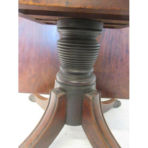 115 - A Regency mahogany breakfast table, the square top raised on fine pod support having turned column a... 