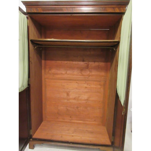 116 - Antique mahogany wardrobe having a dental cornice over sectioned glass and panelled doors and raised... 