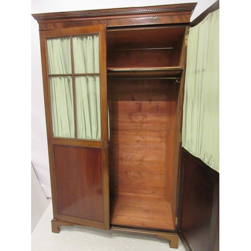 116 - Antique mahogany wardrobe having a dental cornice over sectioned glass and panelled doors and raised... 